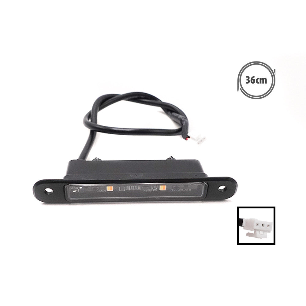 Module d'éclairage LED de châssis noir relié à un câble de 36 cm avec son connecteur.