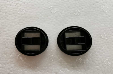 Deux rondelles noires de ressort de béquille pour trottinette électrique Dualtron Storm posées à plat