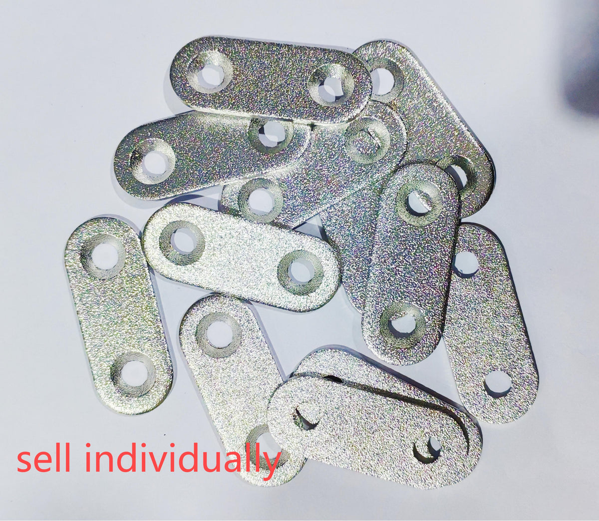 Plaquettes métalliques ovales à deux trous pour fixation de câble sous potence de trottinette électrique