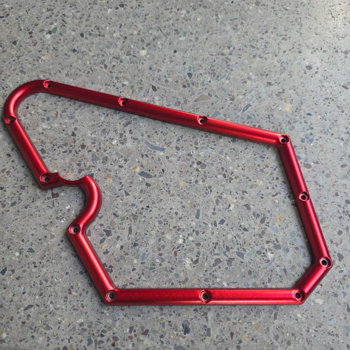 Carénage de potence gauche rouge pour Dualtron Sonic Alien posé à plat sur le sol